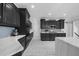 Modern kitchen with gray cabinets, stainless steel appliances, and marble countertops at 2135 Glenfield Trce, Cumming, GA 30041
