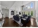 Bright living room with fireplace, soaring windows, and comfortable blue couches at 2135 Glenfield Trce, Cumming, GA 30041