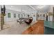 Inviting living room showcases ample natural light, a large sectional, and cozy fireplace, perfect for relaxation at 2135 Glenfield Trce, Cumming, GA 30041