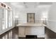 Bright home office with hardwood floors, ample natural light, and stylish built-in shelving at 2135 Glenfield Trce, Cumming, GA 30041