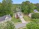 Charming two-story home with well-maintained lawn, mature trees, and a paved driveway in a suburban neighborhood at 3073 Hopeland Dr, Powder Springs, GA 30127