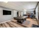 Basement with a billiards table, bar area, TV, and hardwood floors at 3073 Hopeland Dr, Powder Springs, GA 30127