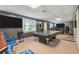 Finished basement rec room with large tvs and custom bar at 3073 Hopeland Dr, Powder Springs, GA 30127