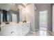 Bright bathroom with a double vanity and walk-in shower at 3073 Hopeland Dr, Powder Springs, GA 30127