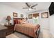 Comfortable bedroom with ceiling fan, stylish decor, and a cozy bed at 3073 Hopeland Dr, Powder Springs, GA 30127