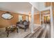 Cozy living room featuring wood-look floors, large windows, a decorative mirror, and stylish furniture at 3073 Hopeland Dr, Powder Springs, GA 30127