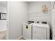 Bright laundry room with white washer and dryer at 323 Silver Leaf Trce, Douglasville, GA 30134