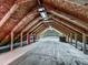 Large unfinished attic with exposed wooden beams, providing possibilities for conversion at 4445 Moon Station Nw Ln, Acworth, GA 30101