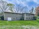 Back of home with large, well-maintained lawn at 4445 Moon Station Nw Ln, Acworth, GA 30101