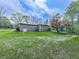 Exterior of home with large lawn and beautiful trees at 4445 Moon Station Nw Ln, Acworth, GA 30101