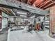 Unfinished basement workspace with a workbench, storage, and industrial elements, perfect for projects at 4445 Moon Station Nw Ln, Acworth, GA 30101