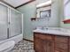 Traditional bathroom with a vanity, marble countertop, a shower and a patterned tile floor at 4445 Moon Station Nw Ln, Acworth, GA 30101