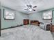 Comfortable bedroom with neutral walls, ceiling fan, and soft carpet flooring, providing a cozy atmosphere at 4445 Moon Station Nw Ln, Acworth, GA 30101