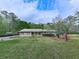 Beautiful house with an inviting porch, lush green lawn, and colorful landscaping for pleasant curb appeal at 4445 Moon Station Nw Ln, Acworth, GA 30101