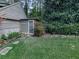 Yard with small storage unit and mature greenery at 4445 Moon Station Nw Ln, Acworth, GA 30101