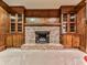 Close up on the brick fireplace between two built in cabinets in the living room at 4445 Moon Station Nw Ln, Acworth, GA 30101