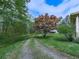 Home nestled among mature trees with a long driveway at 4445 Moon Station Nw Ln, Acworth, GA 30101