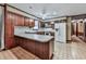 Kitchen with wood cabinets, tile floors and a long island perfect for entertaining at 4445 Moon Station Nw Ln, Acworth, GA 30101