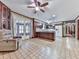 Open kitchen area with tile floors, ceiling fan, lots of light and an open doorway at 4445 Moon Station Nw Ln, Acworth, GA 30101