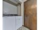 Functional laundry area with washer and dryer hookups, as well as ample space for storage at 4445 Moon Station Nw Ln, Acworth, GA 30101