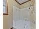 Clean shower area with white tile and a window for natural light at 4445 Moon Station Nw Ln, Acworth, GA 30101