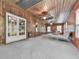 Inviting sunroom with wood accents, many windows and a comfortable seating area at 4445 Moon Station Nw Ln, Acworth, GA 30101