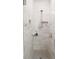 This bathroom features a glass-enclosed shower with built-in shelving and modern fixtures at 4734 Dewitt Dr, Duluth, GA 30097
