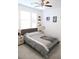 Comfortable bedroom features a ceiling fan, a double window, and natural light at 4734 Dewitt Dr, Duluth, GA 30097