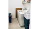 A conveniently located laundry room including modern appliances and extra storage at 4734 Dewitt Dr, Duluth, GA 30097