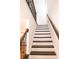 Beautiful staircase with dark wood treads and handrails, and white risers adds a touch of elegance at 4734 Dewitt Dr, Duluth, GA 30097