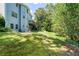 Backyard view featuring a deck and the lower level access to yard at 558 Auburn Rd, Auburn, GA 30011