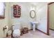 Cozy bathroom featuring a classic toilet, decorative cabinet, and pedestal sink at 558 Auburn Rd, Auburn, GA 30011