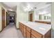 Bathroom showcasing a vanity with solid surface countertop and large mirror at 558 Auburn Rd, Auburn, GA 30011