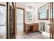 Bathroom features a vanity, toilet, and an open view to an adjoining bedroom at 558 Auburn Rd, Auburn, GA 30011