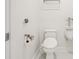 Bathroom featuring a toilet and urinal at 558 Auburn Rd, Auburn, GA 30011