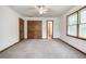 Bedroom with a large window for natural light and a ceiling fan at 558 Auburn Rd, Auburn, GA 30011