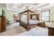 Spacious bedroom features a king-sized bed, tray ceilings, and a brick fireplace at 558 Auburn Rd, Auburn, GA 30011