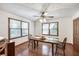 Dining room with hardwood floors, large windows, and traditional decor at 558 Auburn Rd, Auburn, GA 30011