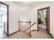 Upstairs hallway with access to rooms and laundry area at 558 Auburn Rd, Auburn, GA 30011
