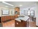 Open kitchen with a breakfast bar and ample counter space, flowing into the dining area at 558 Auburn Rd, Auburn, GA 30011