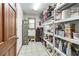 Functional laundry room with ample storage space, utility sink, and a window for natural light at 558 Auburn Rd, Auburn, GA 30011
