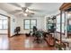 Spacious office featuring hardwood floors, a ceiling fan, and multiple windows for ample natural light at 558 Auburn Rd, Auburn, GA 30011