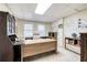 A home office with a large desk and matching storage and bookcase at 558 Auburn Rd, Auburn, GA 30011