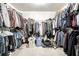 Well-organized walk-in closet with ample hanging space for clothes and accessories at 558 Auburn Rd, Auburn, GA 30011