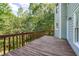 Relaxing on a wooden deck amidst lush greenery and trees at 558 Auburn Rd, Auburn, GA 30011