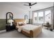 Cozy bedroom with stylish decor, including a ceiling fan, neutral tones, and a large window at 1432 Wicker Wood Se Pl # 9, Smyrna, GA 30080