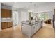 Bright kitchen featuring an island with seating and a seamless transition to the living area at 1432 Wicker Wood Se Pl # 9, Smyrna, GA 30080