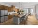 Modern kitchen with a large center island, stainless steel appliances, and an adjacent dining area at 1432 Wicker Wood Se Pl # 9, Smyrna, GA 30080
