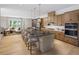 Contemporary kitchen with an expansive island, stainless appliances, and open flow to living space at 1432 Wicker Wood Se Pl # 9, Smyrna, GA 30080