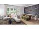Cozy living room with stylish furnishings, large windows, and an open layout at 1432 Wicker Wood Se Pl # 9, Smyrna, GA 30080